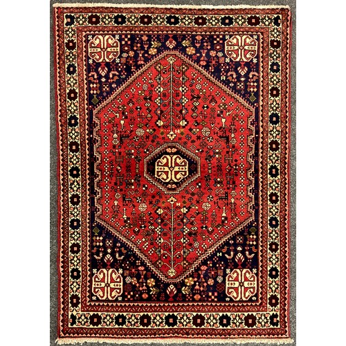 204 - A South-west Persian Abadeh rug / carpet, hand-knotted with octagonal- shaped medallion, within a fi... 