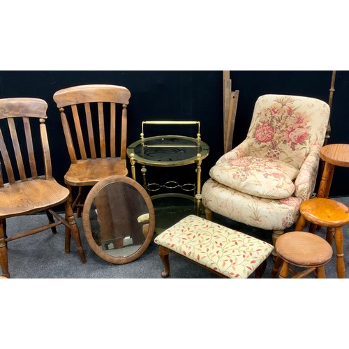 207 - A pair of late 19th century elm lathe back chairs, pine milking stools, nursing chairs, drinks troll... 