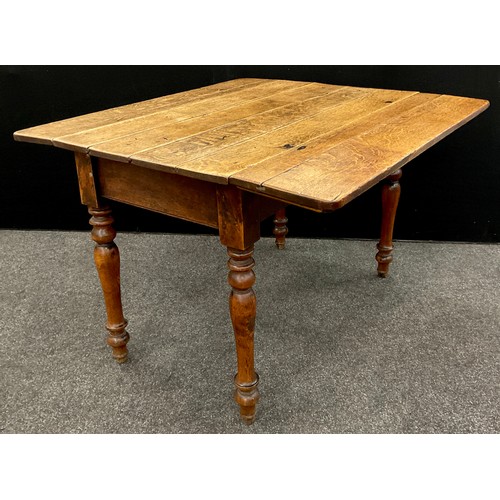 208 - A George III oak plank-top, drop- leaf, kitchen table, 73.5cm high x 109.5cm x 63cm (106cm with leav... 