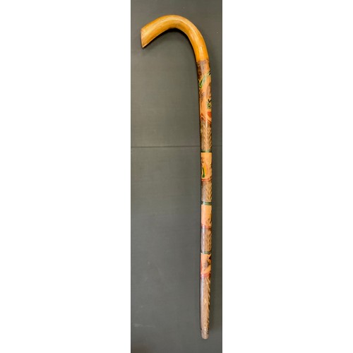 271 - A 1930s Mexican walking stick, carved and painted with the Mexican coat of arms above bull fighting ... 