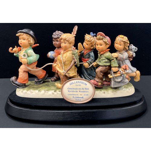 217 - A Hummel Goebel limited edition figure group of ‘Worldwide Wanderers’, No.452/2000, marks the millen... 