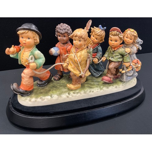 217 - A Hummel Goebel limited edition figure group of ‘Worldwide Wanderers’, No.452/2000, marks the millen... 