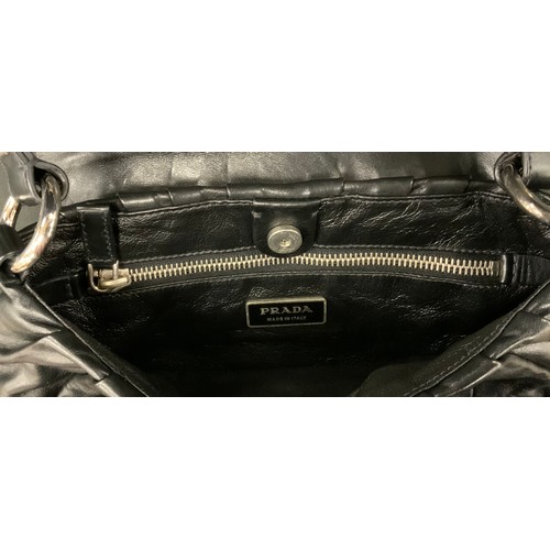 263A - A Prada black leather handbag, top handle, snake skin effect slide catch fittings and shoulder strap... 