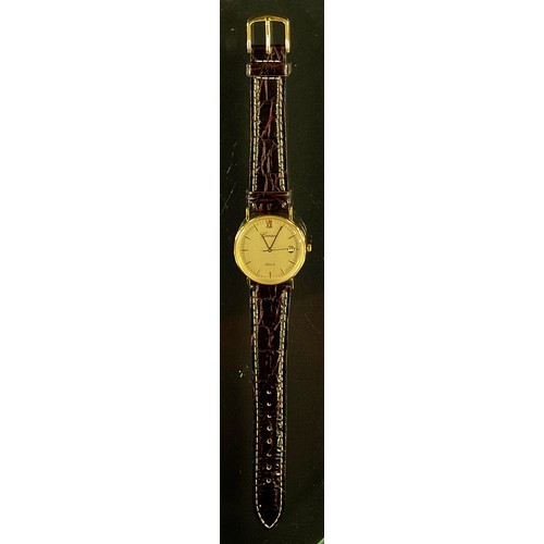 292 - A 9ct gold cased Geneve gold cased wristwatch, gilt dial, block baton markers, quartz movement, leat... 