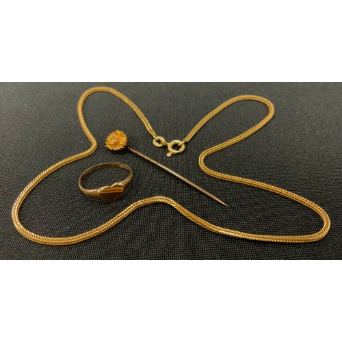 297 - A yellow metal herringbone link necklace, stamped 750 *214 AR, 4.9g;  15ct gold floral tie pin, 0.9g... 