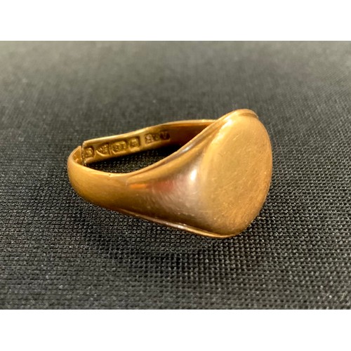 312 - An 18ct gold signet ring, cut, 5.8g