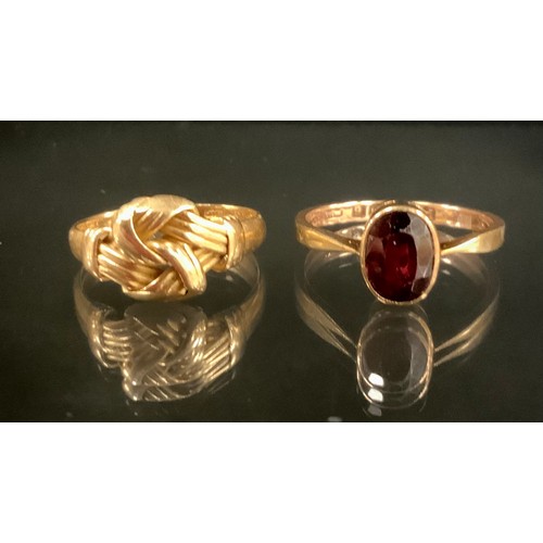 316 - An 18ct gold tied rope ball ring, Birmingham 1897, size N, 3.3g;  9ct rose gold and garnet oval soli... 