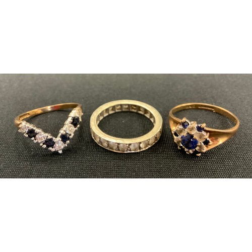 317 - A 9ct gold sapphire and diamond effect V ring;  similar cluster ring,  5.3g gross,  white metal half... 