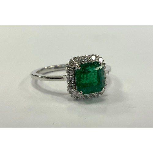 337 - An emerald and diamond cluster ring, emerald cut vibrant green emerald approx 1.29ct, surrounded by ... 