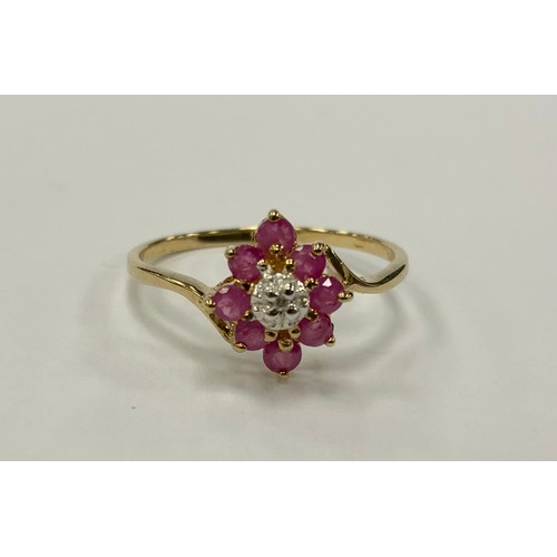 342 - A ruby and diamond cluster ring, central diamond approx 0.02ct, surrounded by eight pink rubies, tot... 