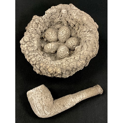 245A - A petrified/calcified birds net, with five eggs, 12.5cm wide;  similar pipe  (2)