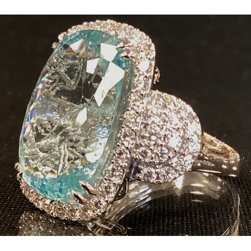 348 - A certified Aquamarine and diamond ring, central mixed cut cushion aquamarine 14.50ct, surrounded by... 