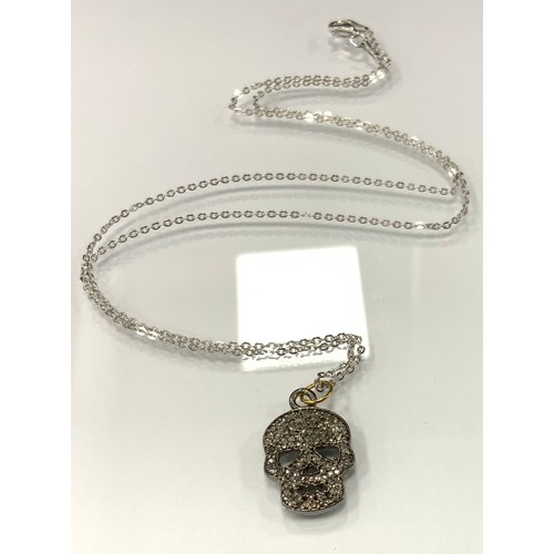 329 - A gothic revival diamond skull pendant necklace, pave encrusted with rose and mixed old cut diamonds... 