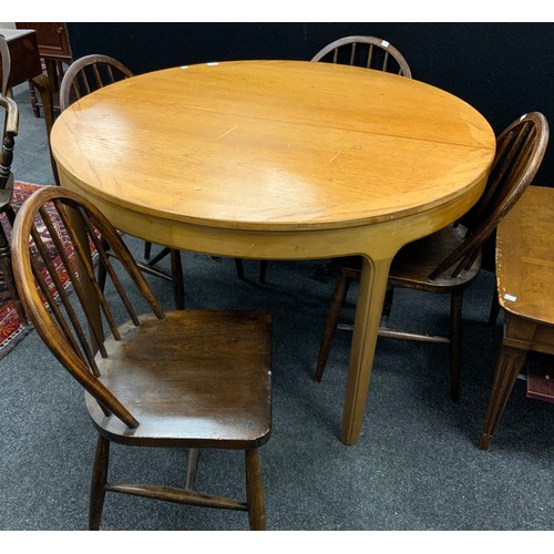 195 - A Nathan Furniture extending dining table, 75cm high x 122cm diameter;  with a set of four mid 20th ... 