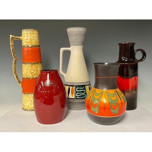 3061 - A West German fat lava type conical jug, in bands or orange and ochre, 35cm; four other West German ... 