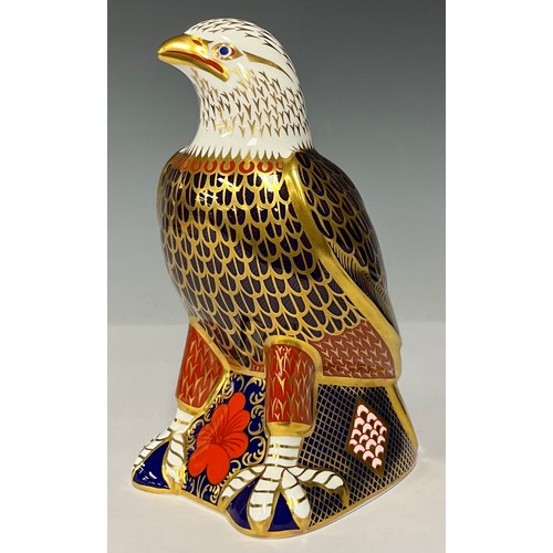 3031 - A Royal Crown Derby paperweight, Bald Eagle, gold stopper, 18cm high, printed marks in red, boxed