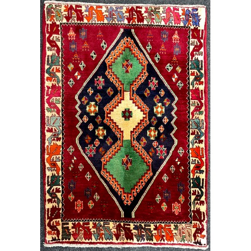 104 - A South-west Persian Qashgai rug / carpet, hand-knotted with a triple medallion, within a field of s... 