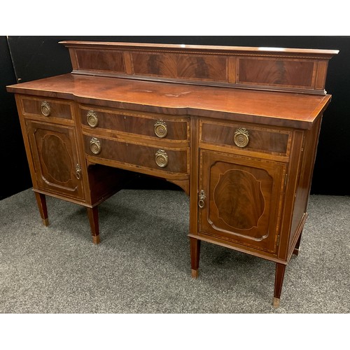 106 - An early 20th century reproduction mahogany break-centre sideboard. Quarter galleried back, Kingwood... 