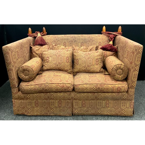 126 - A Liberty and Co. style Knowle two seat sofa, of typical form with two loose cushion seats, six loos... 