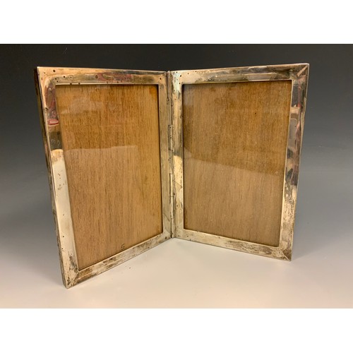 277 - A silver diptych double photograph frame, marked Sterling