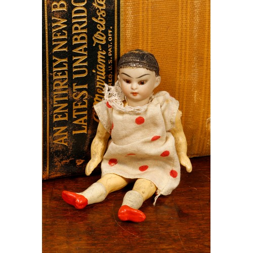 7159 - A bisque head and composition bodied miniature Oriental doll, probably by Simon & Halbig (Germany), ... 