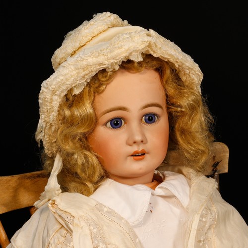 7163 - A Simon & Halbig (Germany) bisque head and painted composition bodied doll, the bisque head inset wi... 