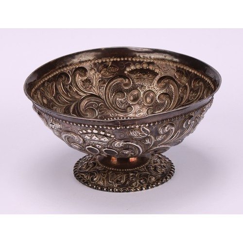 15 - A 19th century Dutch silver pedestal bowl, chased with scrolling foliage and stylised crowns within ... 