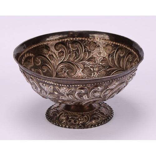 15 - A 19th century Dutch silver pedestal bowl, chased with scrolling foliage and stylised crowns within ... 