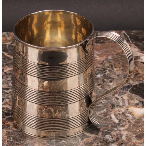 40 - The Bateman Family -a George III silver spreading cylindrical mug, reeded bands and scroll handle, 1... 