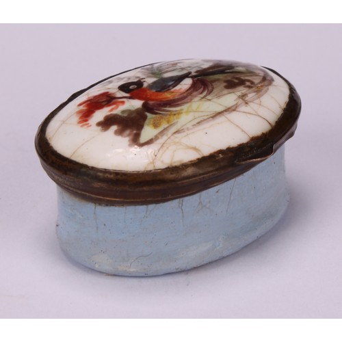 44 - A George III South Staffordshire enamel oval patch box, hinged cover painted with a bird, pale blue ... 