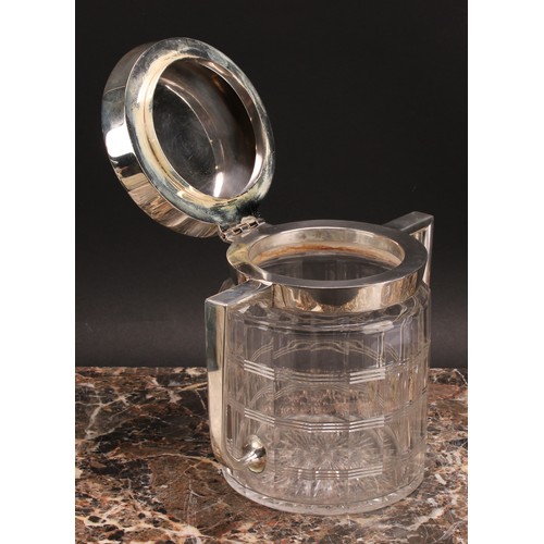 53 - An Arts and Crafts E.P.N.S mounted clear glass biscuit box, of Christopher Dresser influence, hinged... 