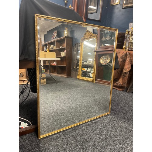 457 - A gilt framed mirror, bevelled glass, 99cm high x 89cm wide