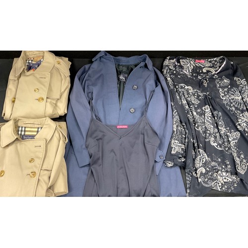 103 - Burberry - a lady's blue rain coat, size approx 14;  others two full length rain coats, size 14,  Za... 