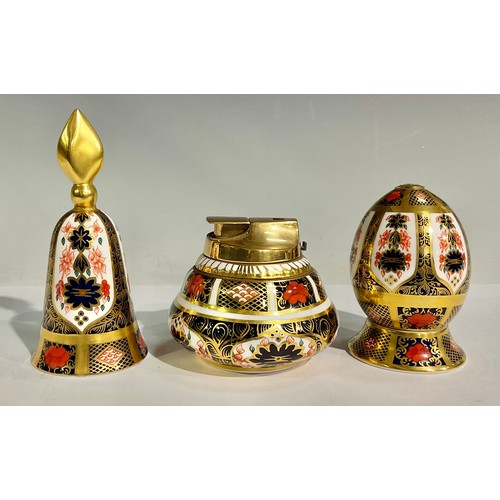 44 - A Royal Crown Derby 1128 Old Imari pattern egg on stand, solid gold band, 8.5cm high overall, first ... 