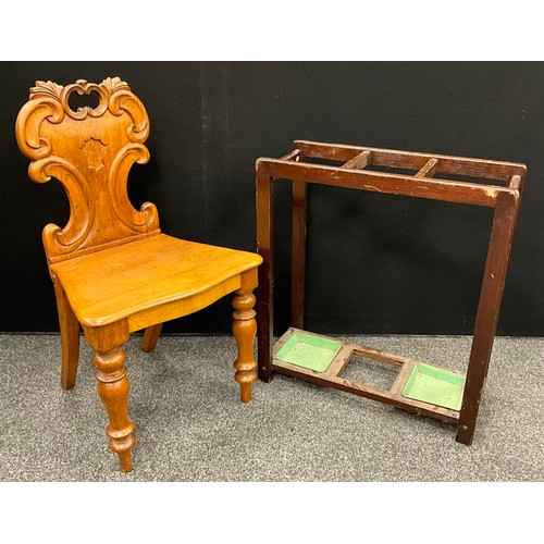 110 - A Victorian oak hall chair, c.1860; a three-section umbrella or walking stick stand (2)

***Please n... 