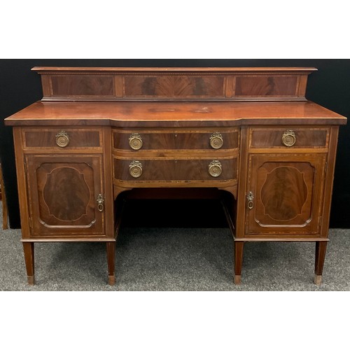 112 - An early 20th century reproduction mahogany break-centre sideboard. Quarter galleried back, Kingwood... 