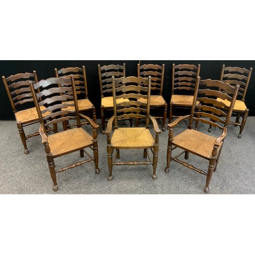 134 - A long set of nine ladder-back elm and stained beech chairs, comprised of six chairs, and three carv... 