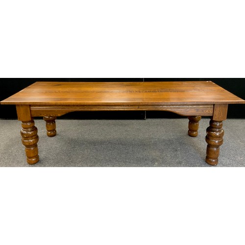 135 - A large oak plank top dining table, thick solid oak top, raised on broad turned legs, 76.5cm high x ... 