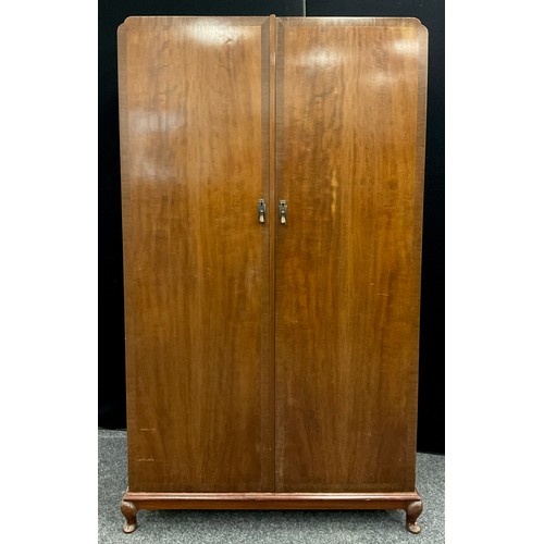 147 - A mid 20th century mahogany compactum double wardrobe, fitted interior to one side with seven gradua... 