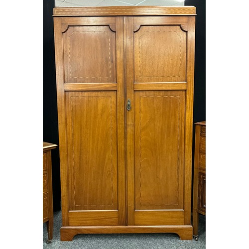 148 - An Edwardian inlaid mahogany three-piece bedroom suite, comprising double wardrobe, 188cm high x 108... 