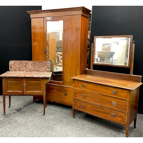 150 - An Edwardian three-piece mahogany bedroom suite - single wardrobe with glazed door to centre, large ... 