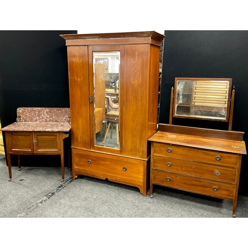 150 - An Edwardian three-piece mahogany bedroom suite - single wardrobe with glazed door to centre, large ... 