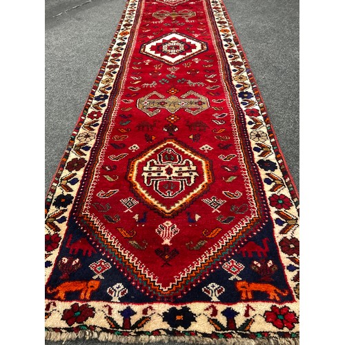 152 - A South-west Persian Qashgai runner carpet, hand-knotted in rich colours, with five medallions, with... 