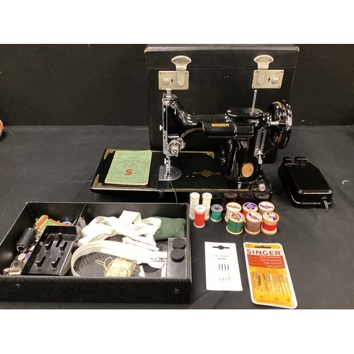 212 - A Singer sewing machine, model 221KI, in case, with instruction manual, manufacture number EF564991 ... 