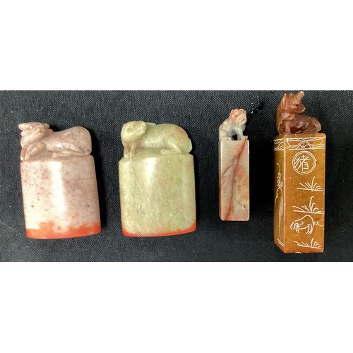 222 - A carved Chinese stone seal stamp, foe dog top, others Oxon, mythical beast calligraphy set etc part... 