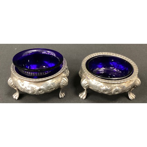 243 - A pair of Victorian silver open salts, Henry Holland, London 1867, 121.1g, one with associated blue ... 