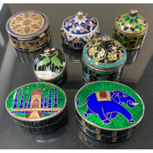 253 - An enamelled white metal pill box, Taj Mahal;  others Elephant, floral etc, all unmarked white metal... 