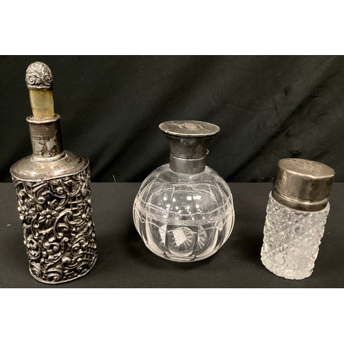 261 - A Victorian silver mounted scent bottle, embossed floral body, marks worn;  another hobnail cut glas... 