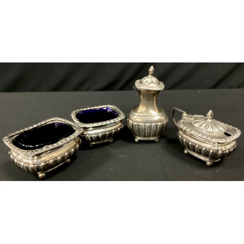 265 - A matched silver condiment set, John & William F Deakin, Chester 1900-1903, open salts, mustard and ... 