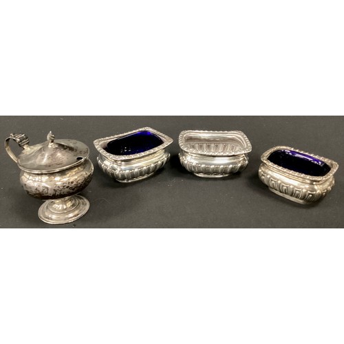 267 - A pair of Victorian silver open salts, Birmingham 1896, another smaller 1903, two with blue glass li... 